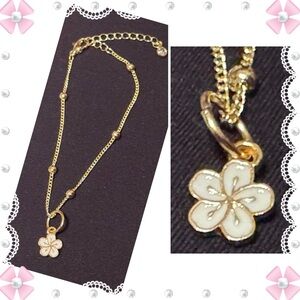 Bracelet - 9” - gold tone beaded bracelet with white enamel flower charm   New!